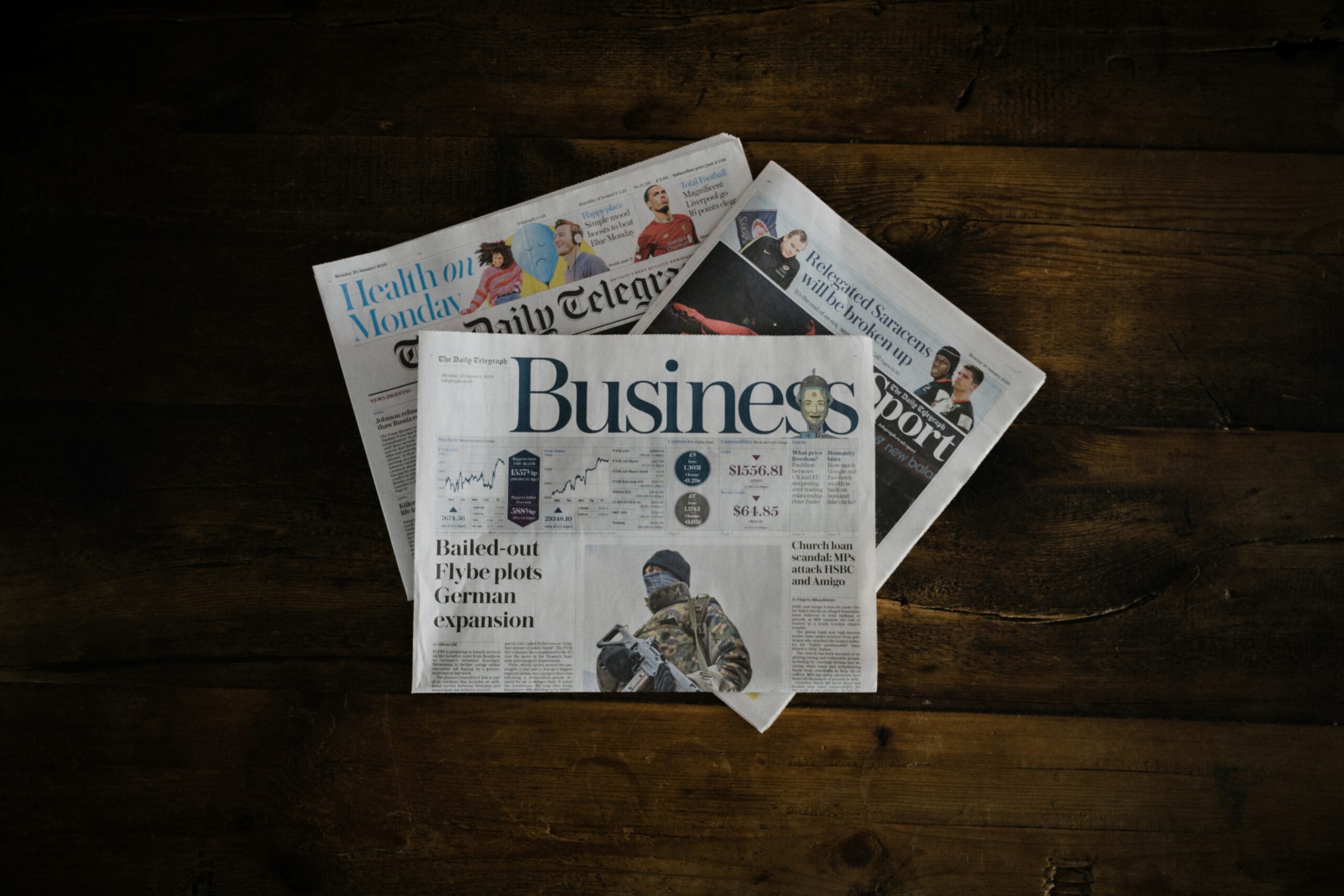 Three newspapers covering business and finance issues.