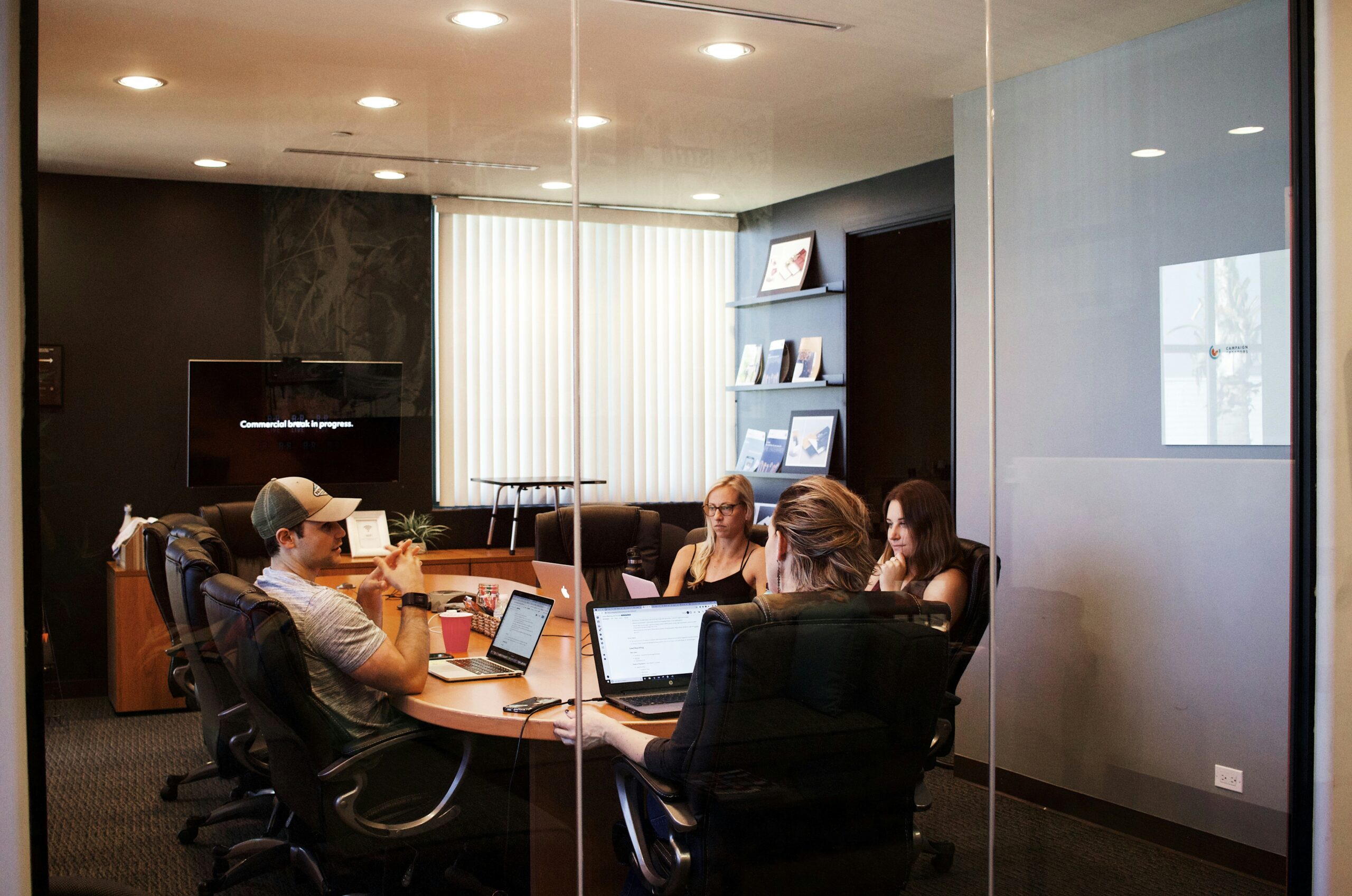 Work colleagues sitting together in a conference room.