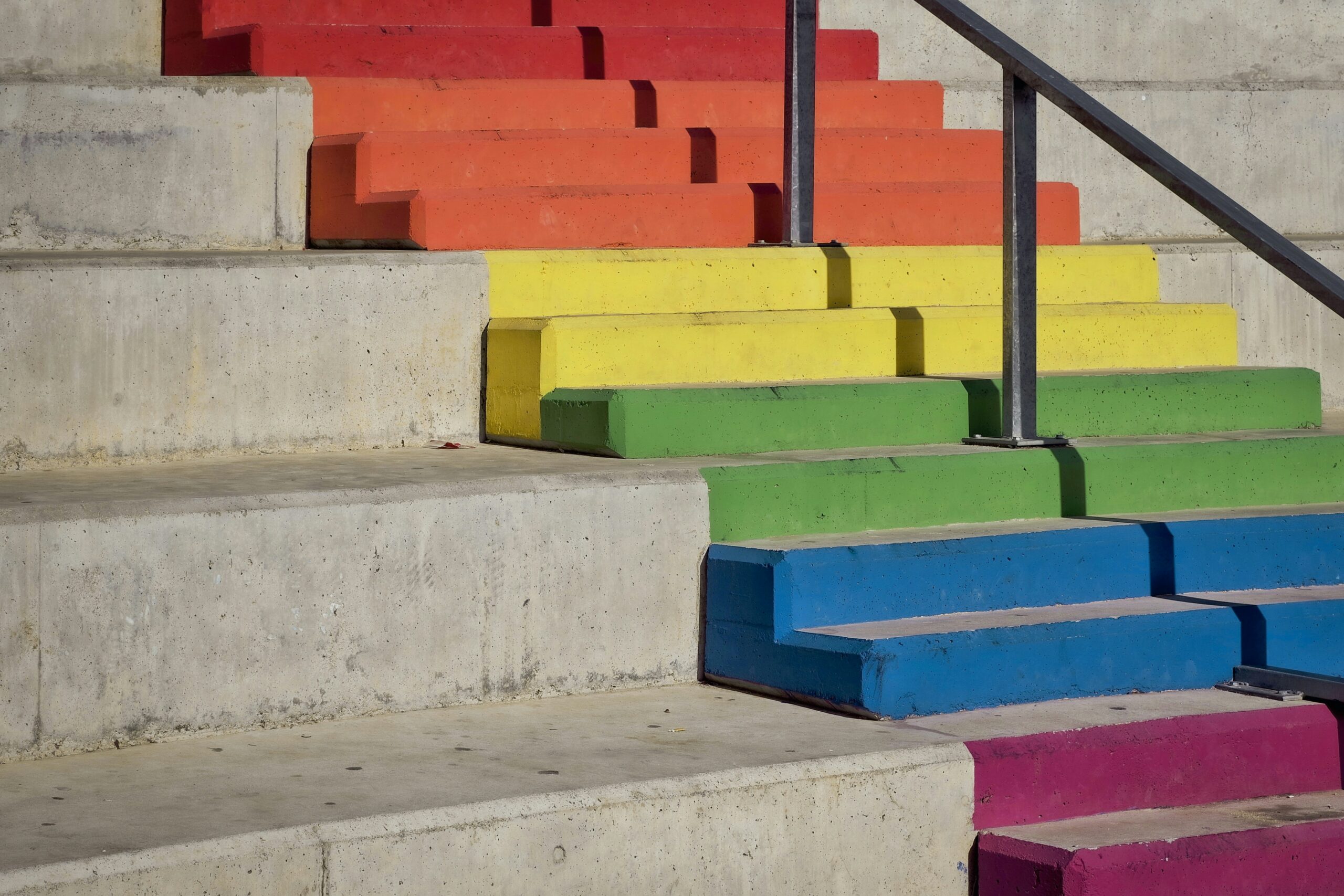 Stairs painted with rainbow colors.